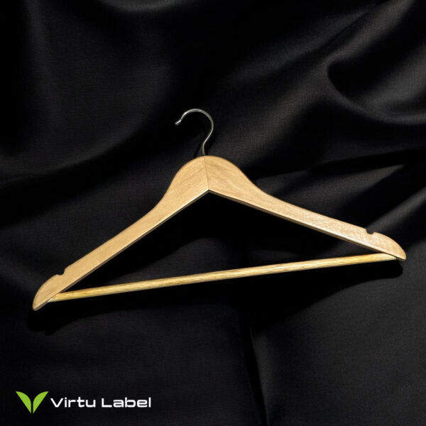 wooden hanger on black fabric