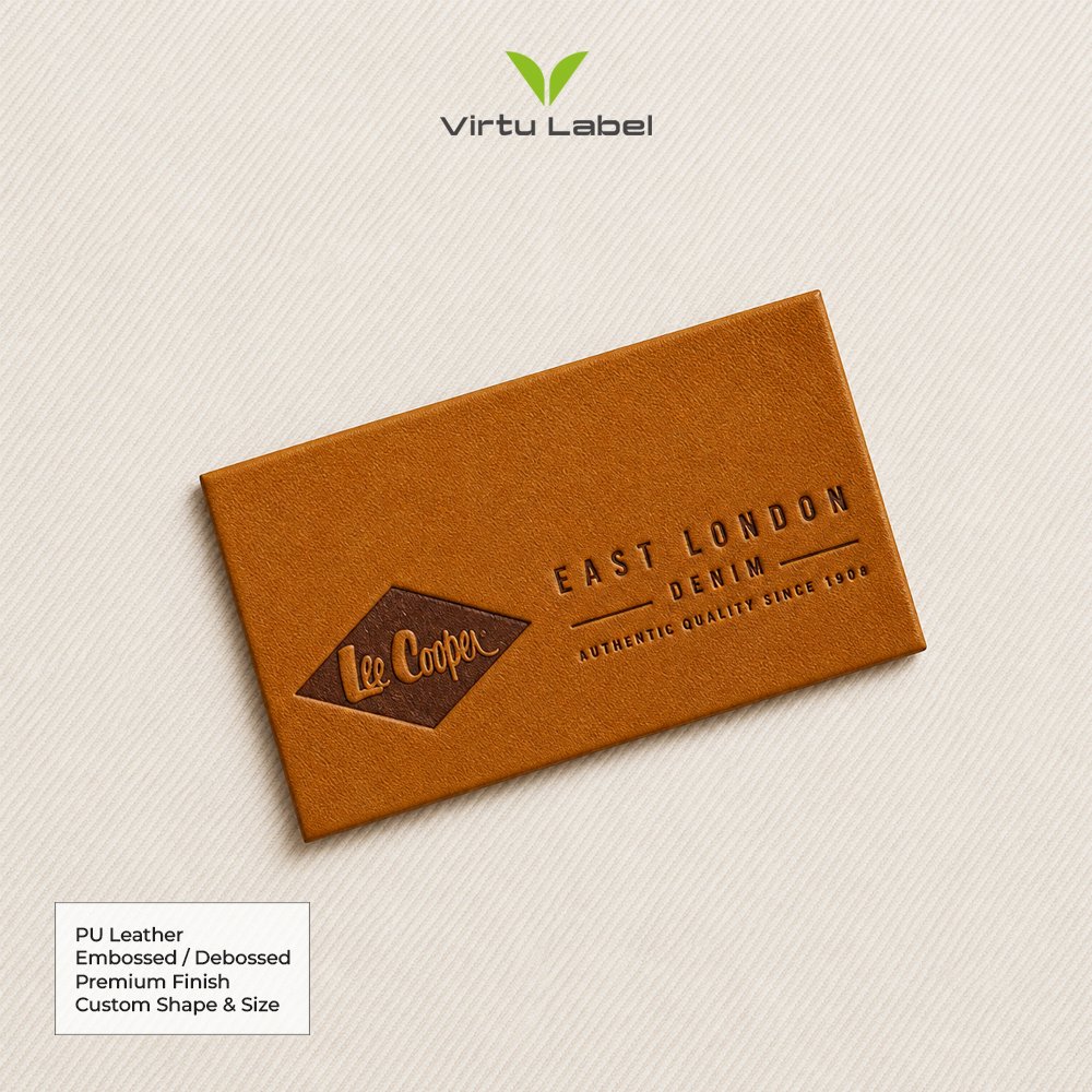 Brown PU leather patch with embossed Lee Cooper and East London denim branding