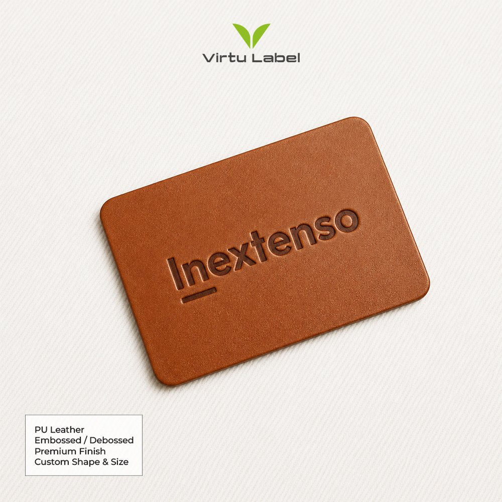 Brown PU leather patch with custom embossed Inextenso logo