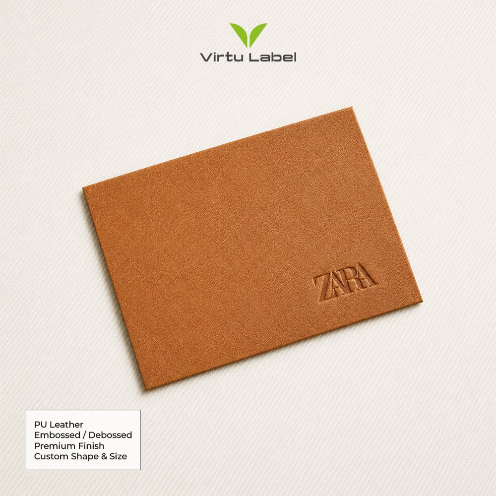 Brown PU leather patch with embossed Zara logo for clothing branding