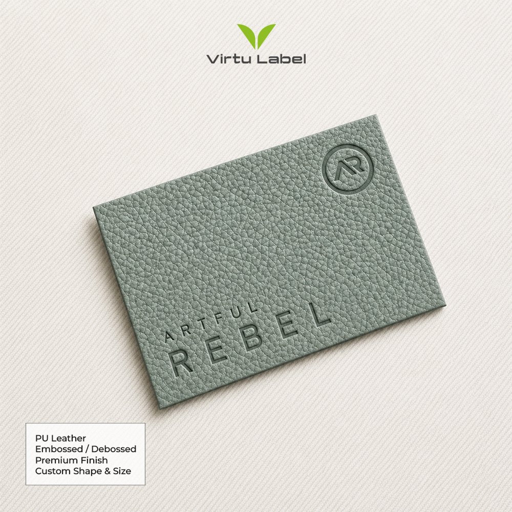 Green gray PU leather patch with embossed Rebel logo and textured finish