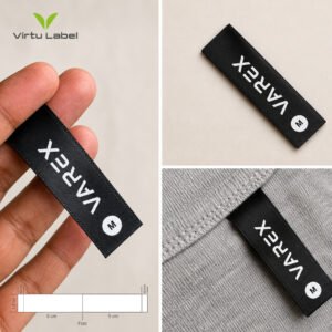 Custom black satin clothing label with white branding and size mark
