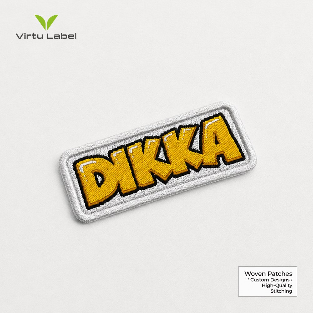 Premium embroidered DIKKA patch with yellow lettering and detailed stitching